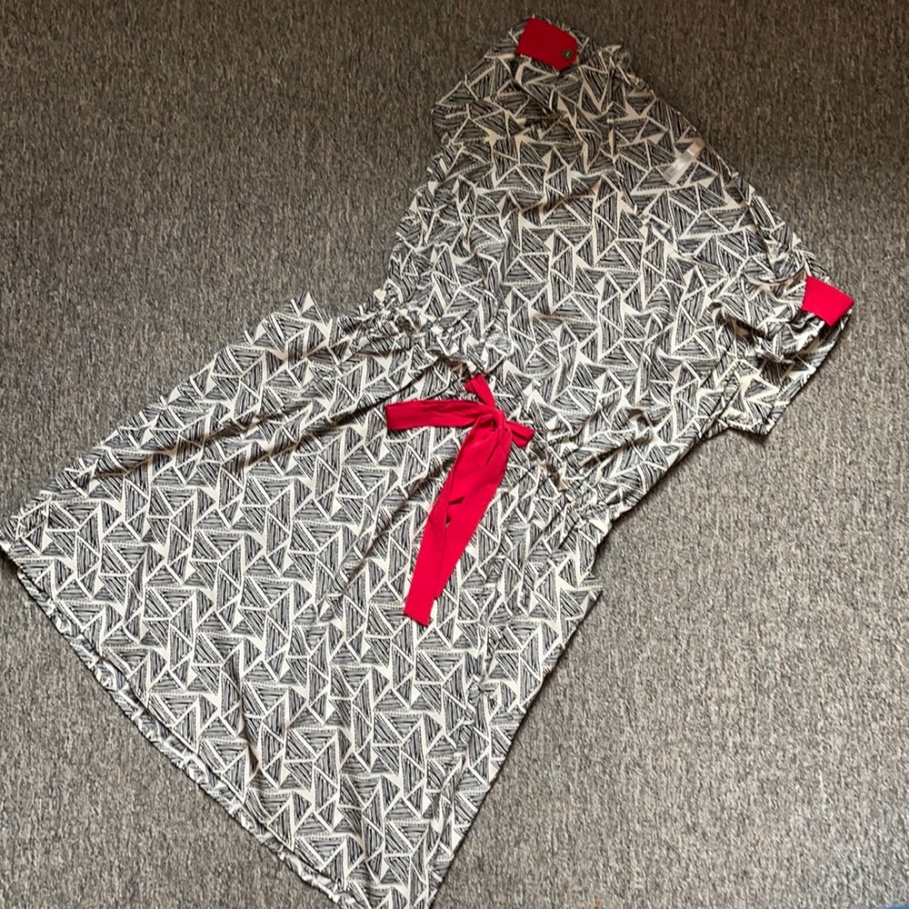 Black and white pattern dress with red accents